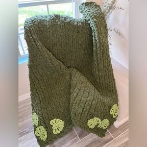 Beautiful handmade olive green knit blanket with monstera leaves